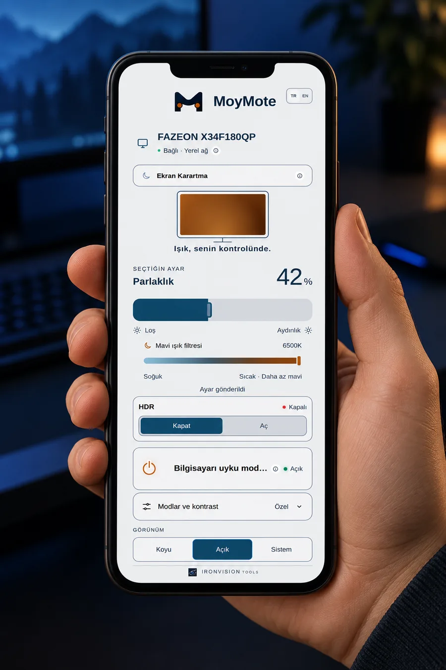 MoyMote running on a phone in light appearance, held in hand, controlling a monitor's brightness